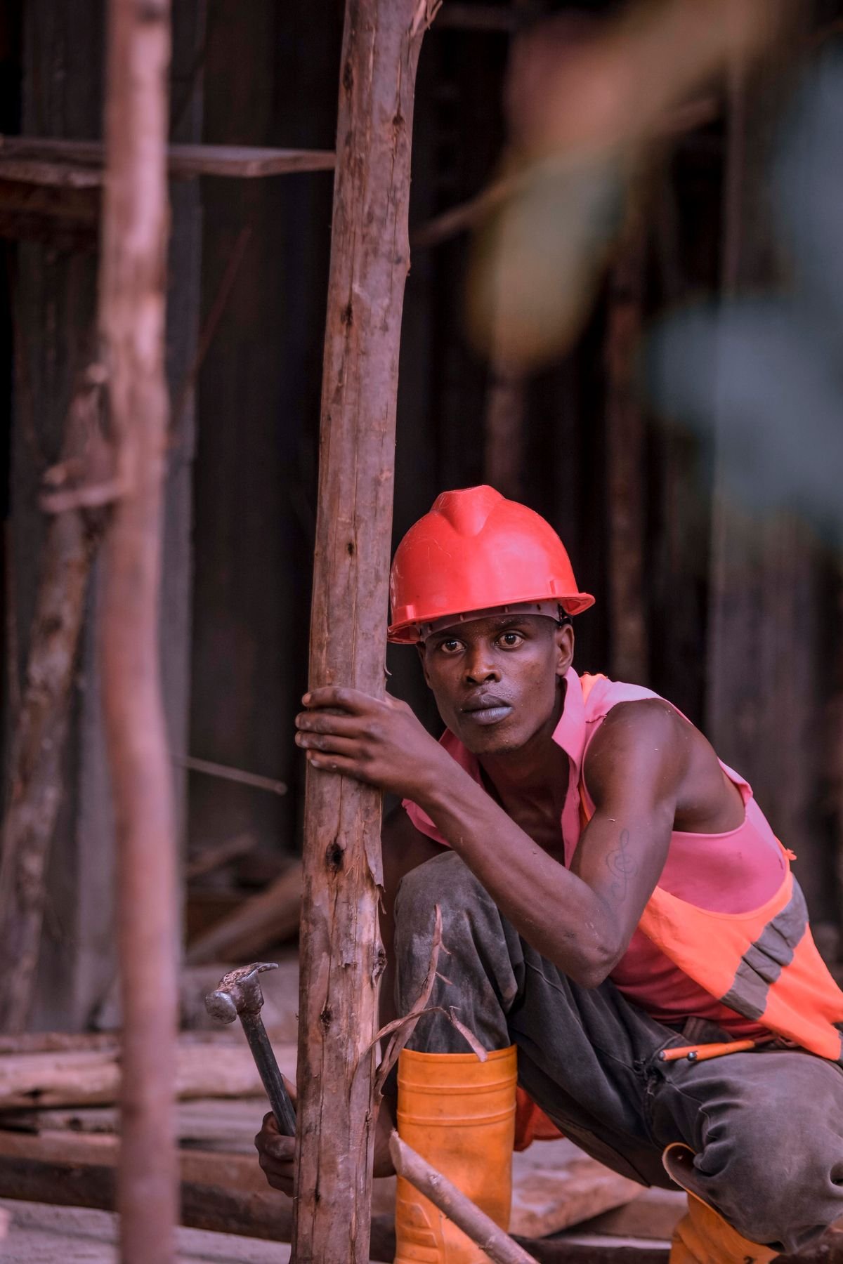 Maintenance professional carrying tools at an industrial worksite