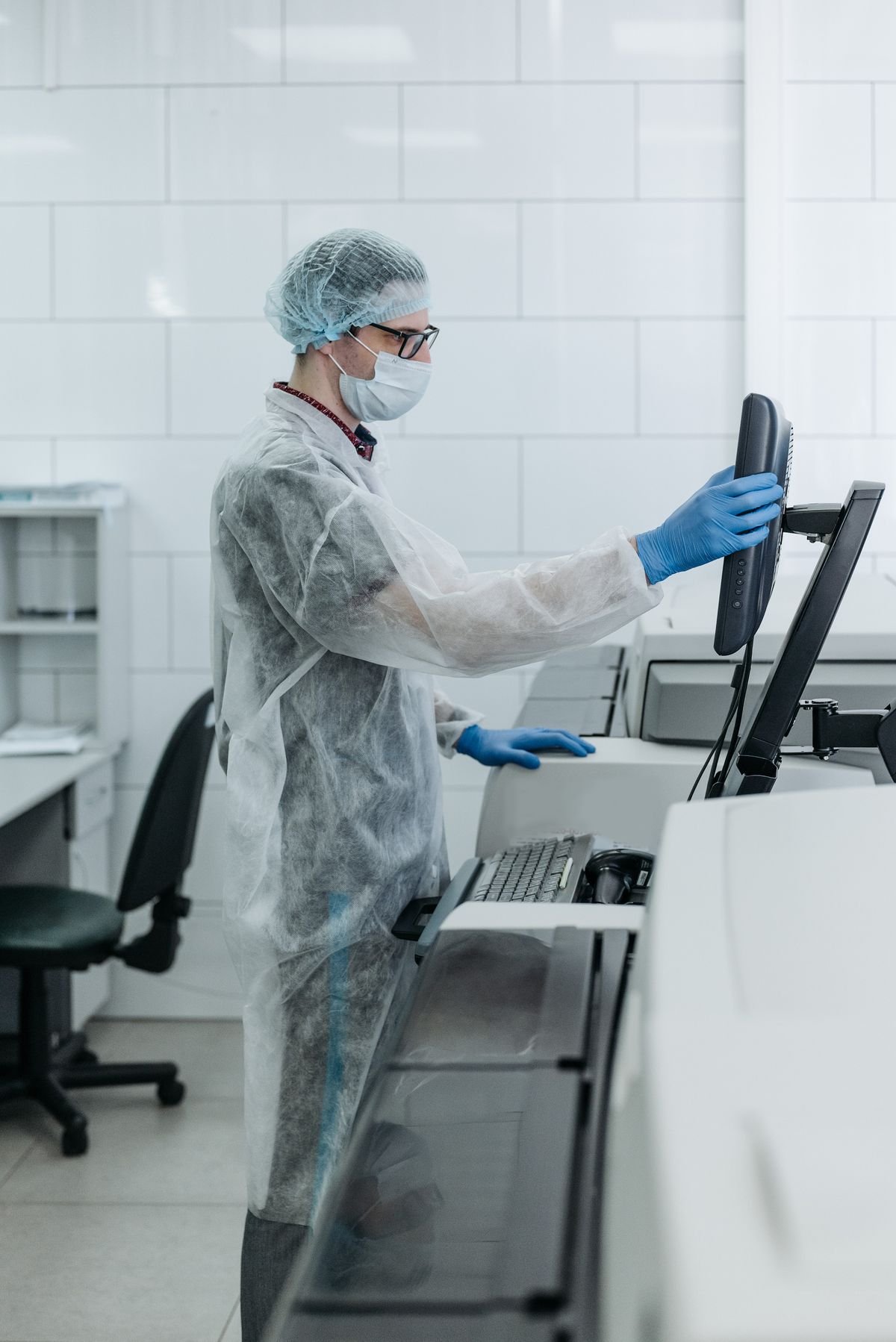 Scientist wearing protective equipment in a laboratory
